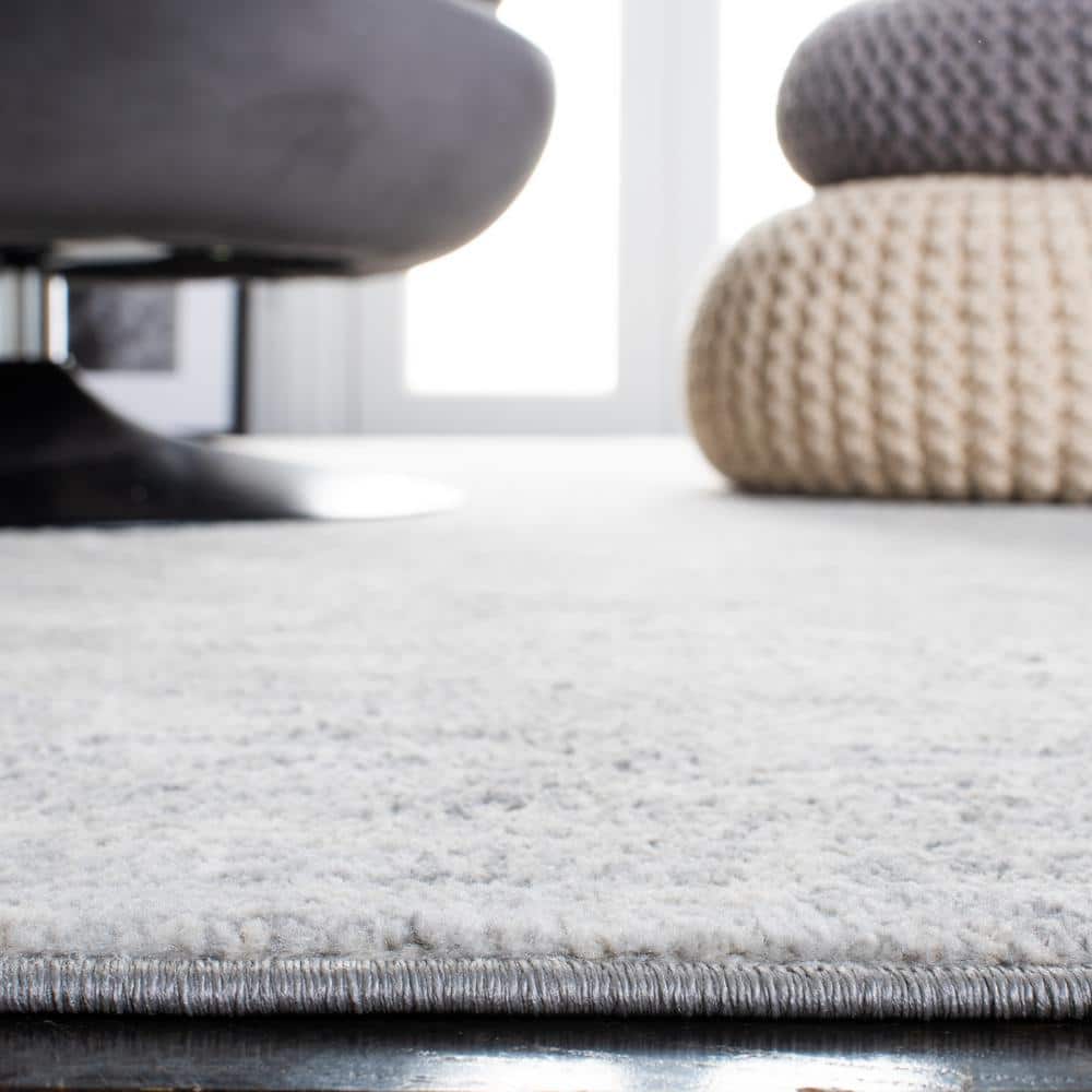 Brentwood Ivory and Gray 8' x 10' Synthetic Rectangular Area Rug