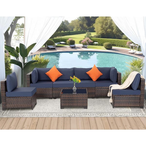 Zeus & Ruta 7-Piece Brown PE Rattan Wicker Outdoor Sectional Sofa Set with Navy Blue Cushions and Coffee Table