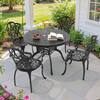 Black 5-piece cast aluminum outdoor dining set with a round table and four chairs with off-white cushions.