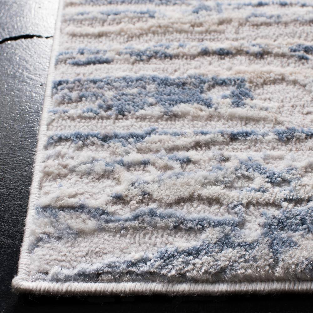 Ivory and Blue Abstract Synthetic Area Rug, 3' x 5'