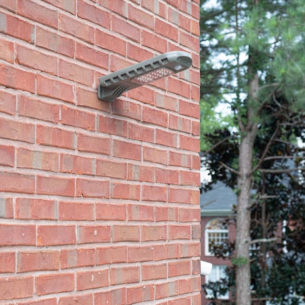 GAMA SONIC Solar 810 Lumen Dark Grey 2-in-1 Outdoor Motion Activated Security Area Wall Flood Light with Timer Wall and Post Mount