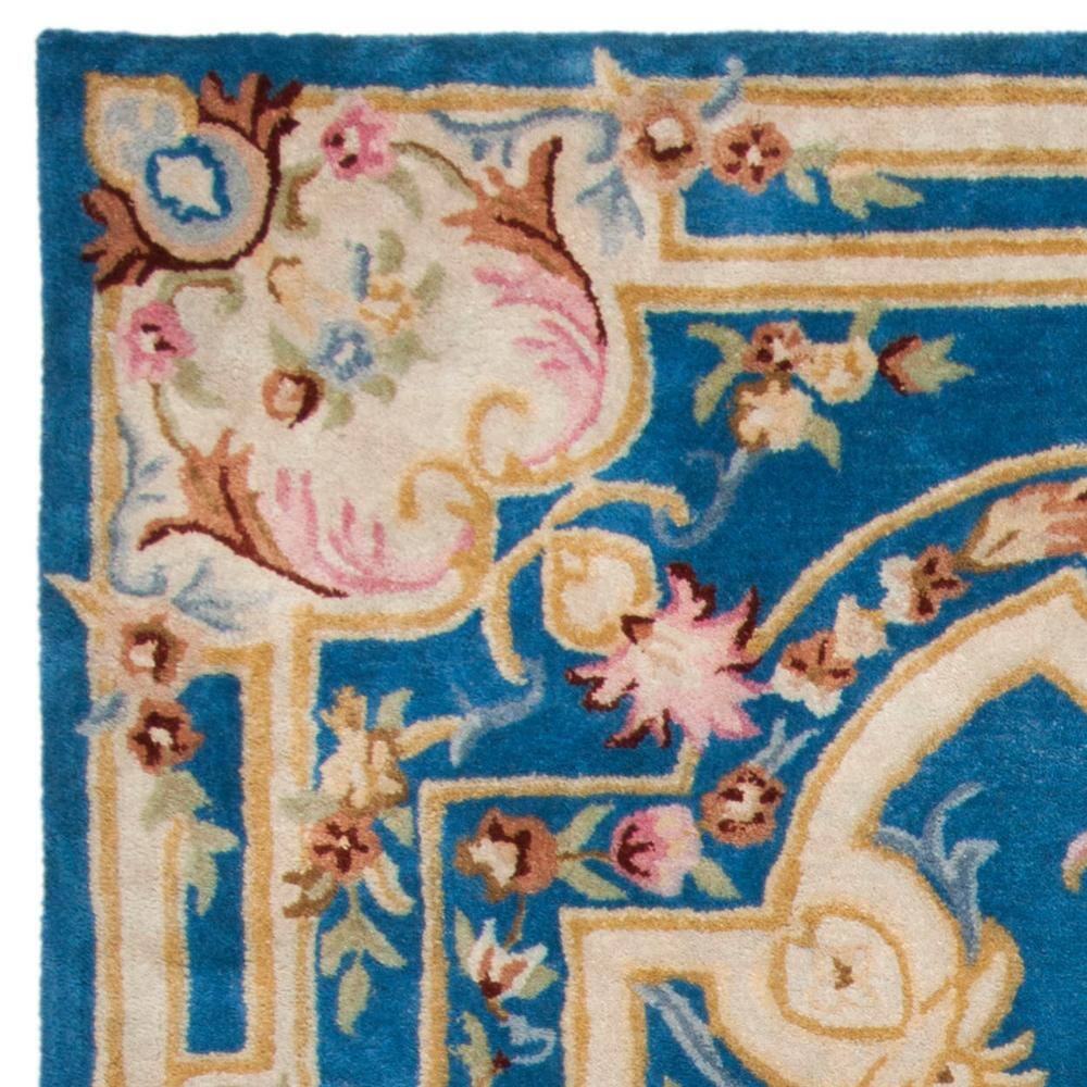 Handmade Blue and Ivory Floral Wool 8' x 10' Area Rug