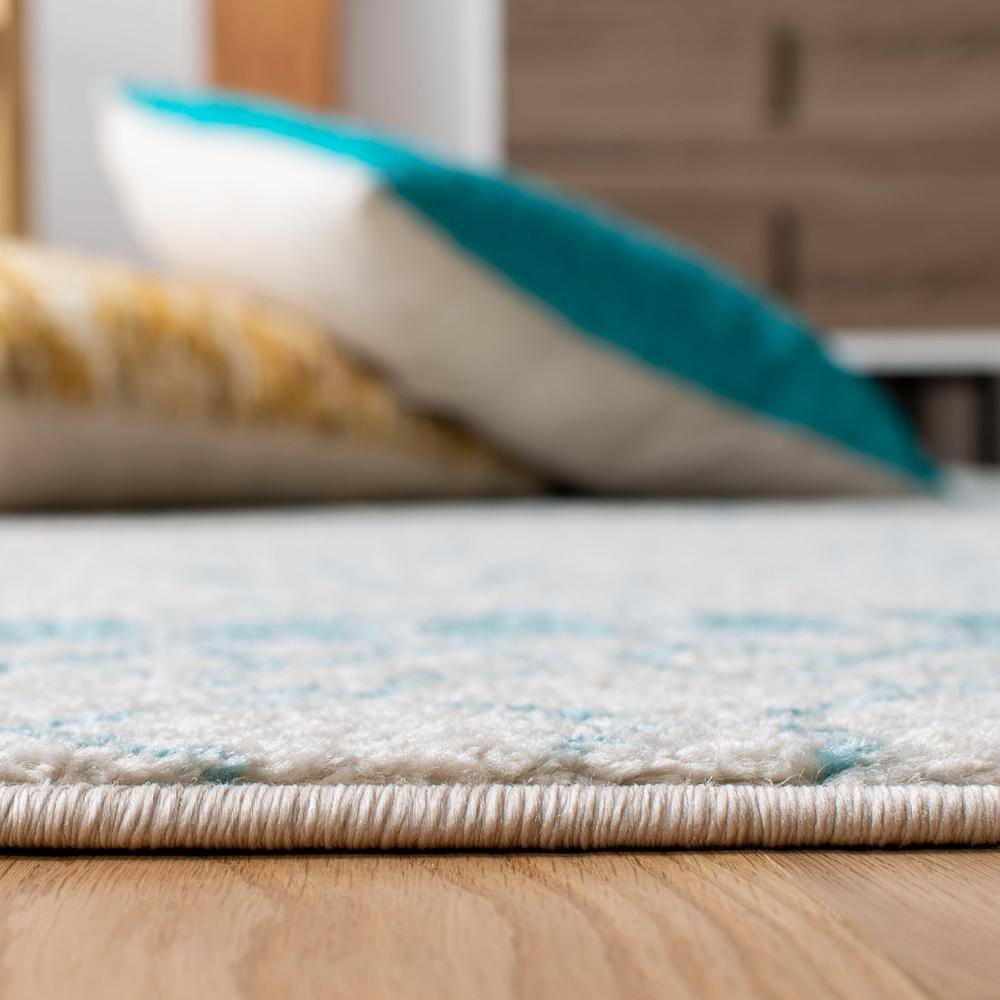Ivory and Turquoise Moroccan Geometric 8' x 10' Area Rug