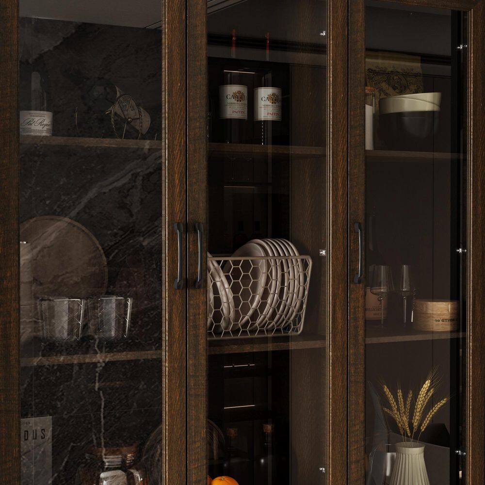 Close-up of the glass doors and interior shelves of the walnut cabinet.