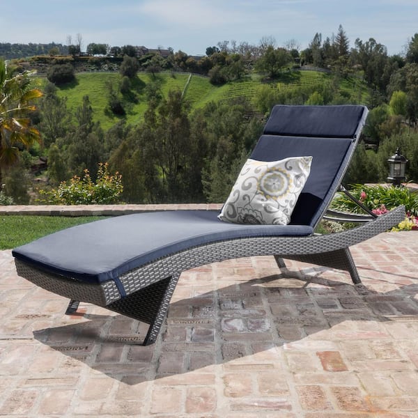 Noble House Miller Gray Armless Faux Rattan Outdoor Chaise Lounge with Navy Blue Cushion