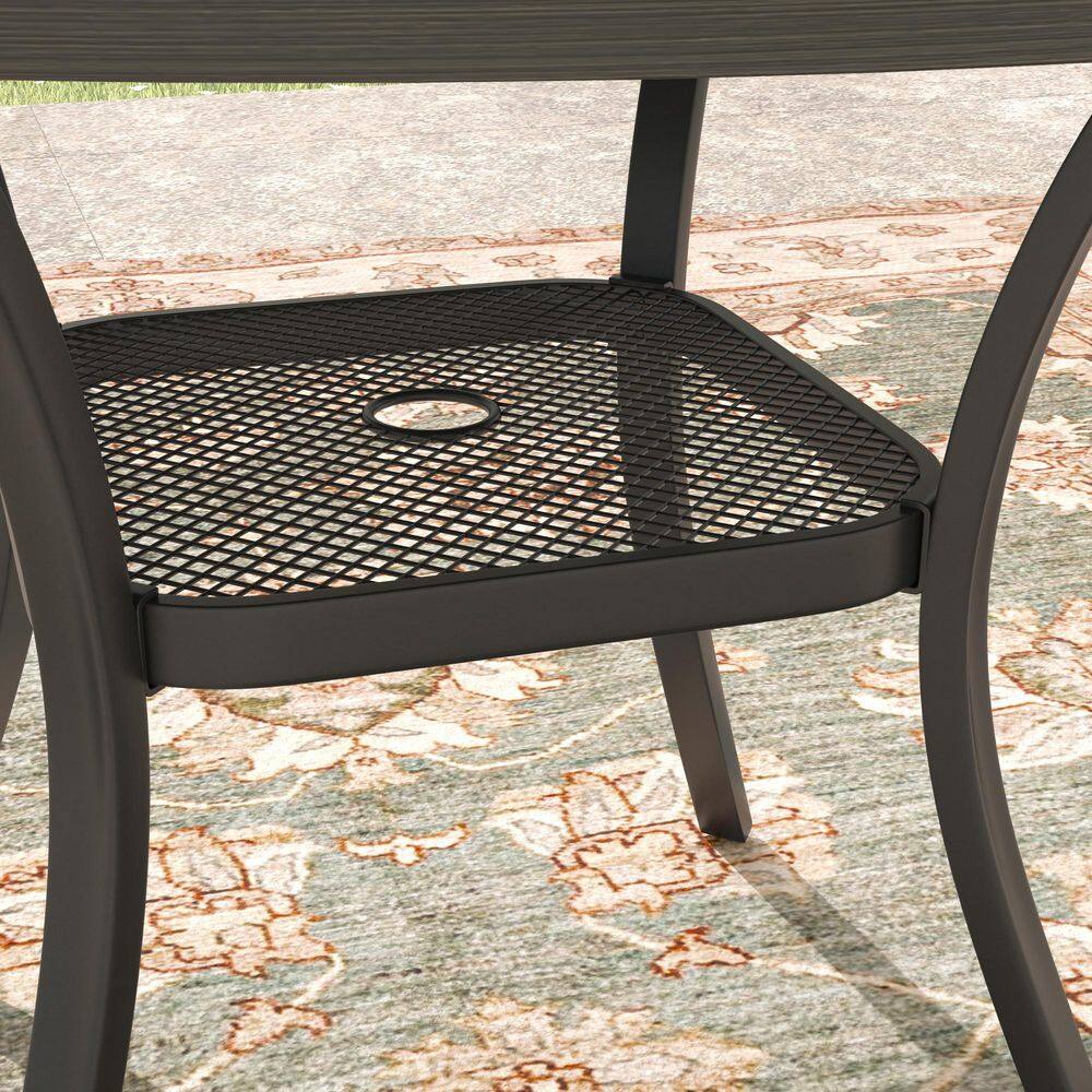 Close-up of the metal mesh seat of the outdoor table.
