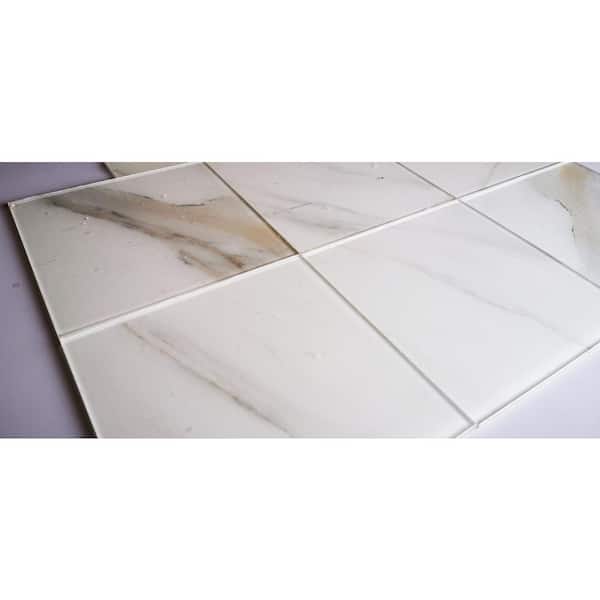 https://images.thdstatic.com/productImages/cbea1a3d-11eb-4cef-a217-c8dda27ef1ba/svn/calacatta-white-glossy-abolos-glass-tile-ghmwtj0808-ca-1f_600.jpg