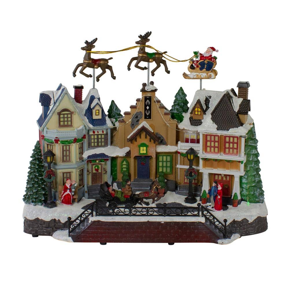 Northlight 11 in. H x 16 in. W LED Lighted and Animated Christmas Village  with Flying Sleigh 34109649 - The Home Depot