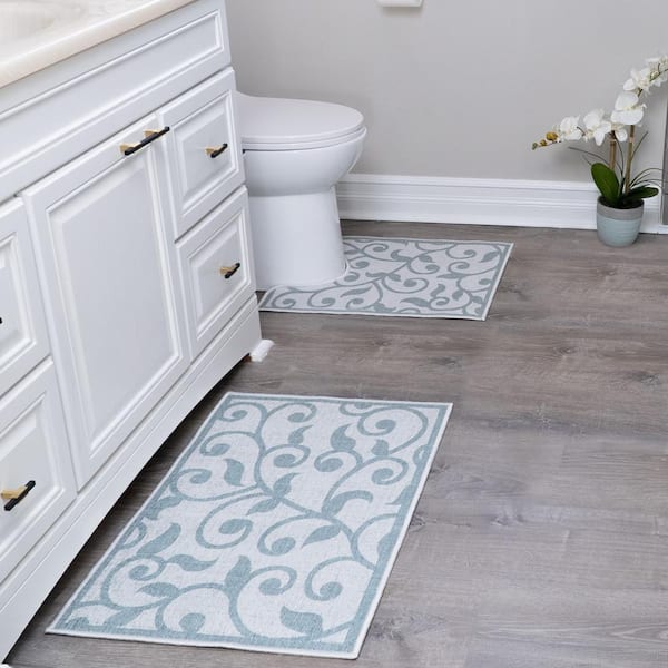 https://images.thdstatic.com/productImages/cc0cfd37-87dd-47b7-8f13-2b377d4e1a12/svn/floral-teal-sussexhome-bathroom-rugs-bath-mats-cntr-hl-01-set2-31_600.jpg
