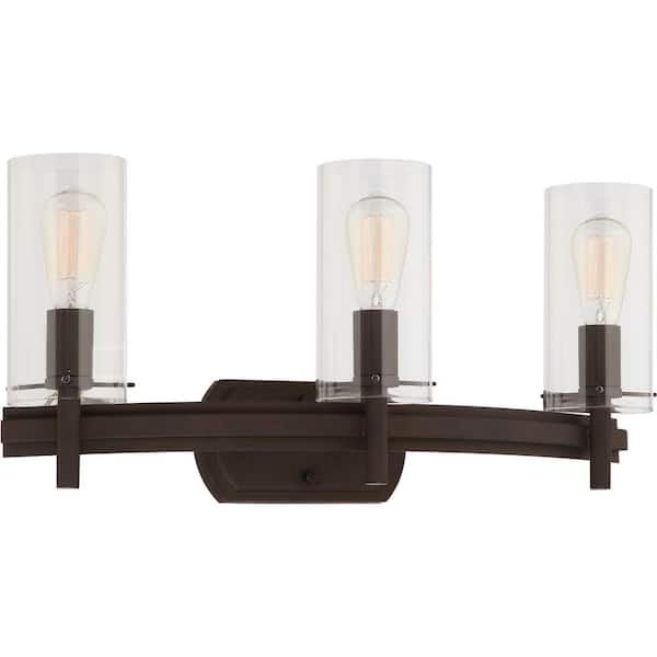 Volume Lighting Regina 3-Light 8 in. Antique Bronze Indoor Bathroom Vanity Wall Sconce or Wall Mount with Clear Glass Cylinder Shades