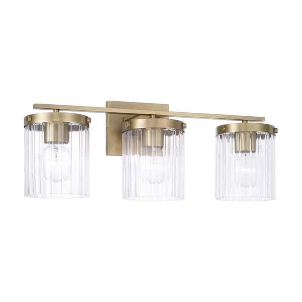 Vaughn 24 in. W x 9 in. H 3-Light Aged Brass Vanity Light with Clear Beveled Fluted Glass