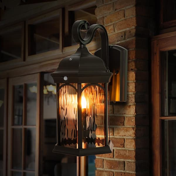 16.1 in. Bronze Integrated LED Motion Sensing Dusk to Dawn Outdoor Wall Light Lantern Sconce with Flickering Bulb