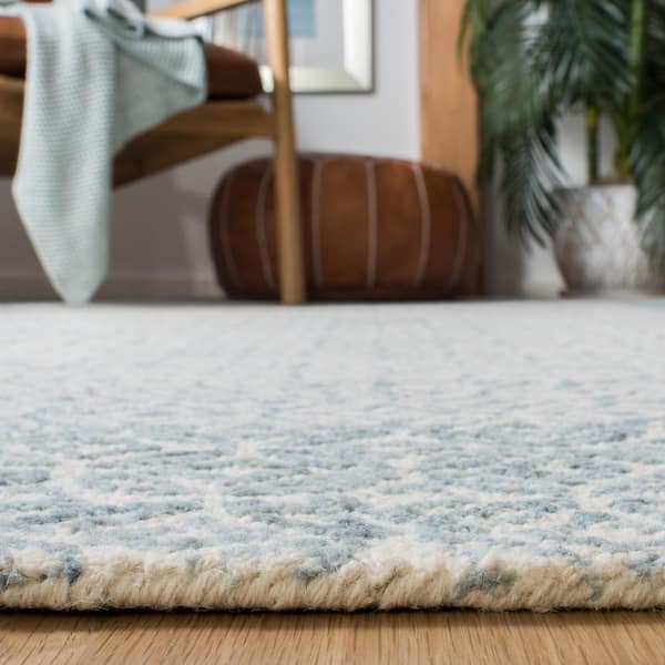 https://images.thdstatic.com/productImages/cd2855bd-2dd1-43f6-832e-a295cce69011/svn/blue-ivory-safavieh-area-rugs-abt342n-6sq-c3_600.jpg