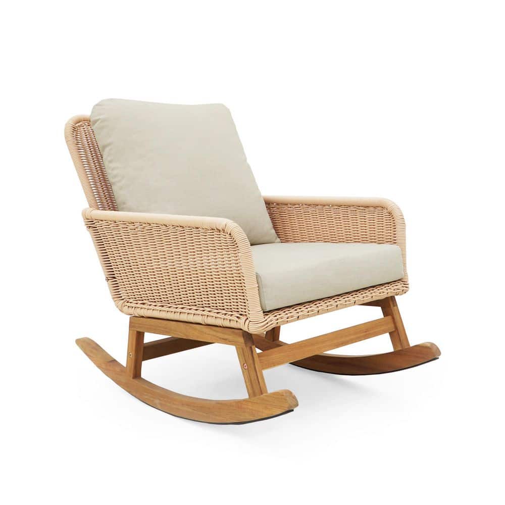Beige wicker rocking chair in a lifestyle setting.
