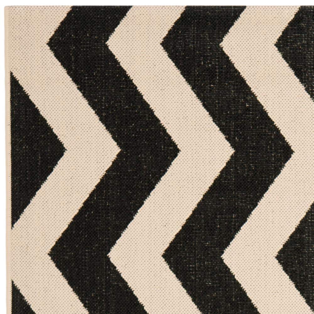 Elegant Black and Beige Rectangular Synthetic Area Rug - 47"x5'7"