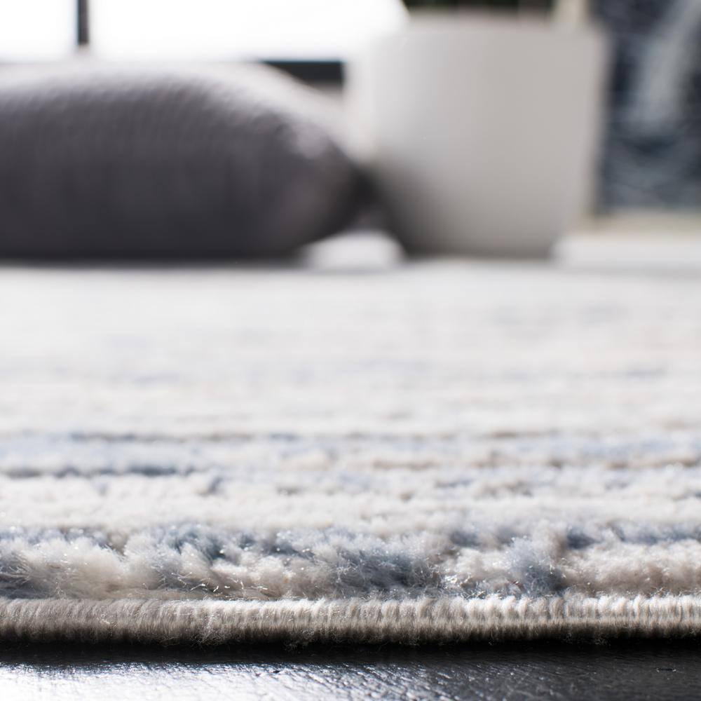 Amelia Ivory and Blue Round Synthetic Area Rug