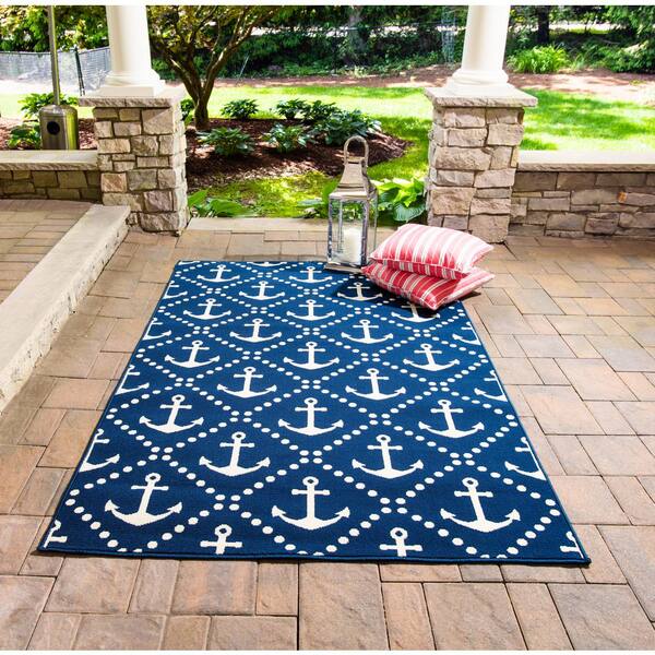 https://images.thdstatic.com/productImages/cdb2b13c-ac92-44da-800a-0dca5e4c4857/svn/navy-momeni-outdoor-rugs-baja0baj16nvy860d-44_600.jpg