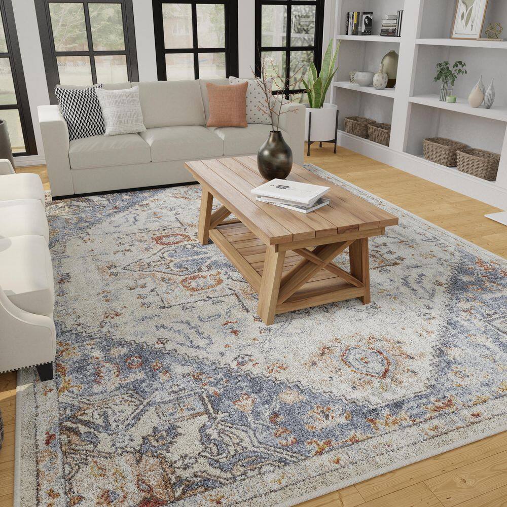 Cream and Blue 6' x 9' Synthetic Oriental Area Rug