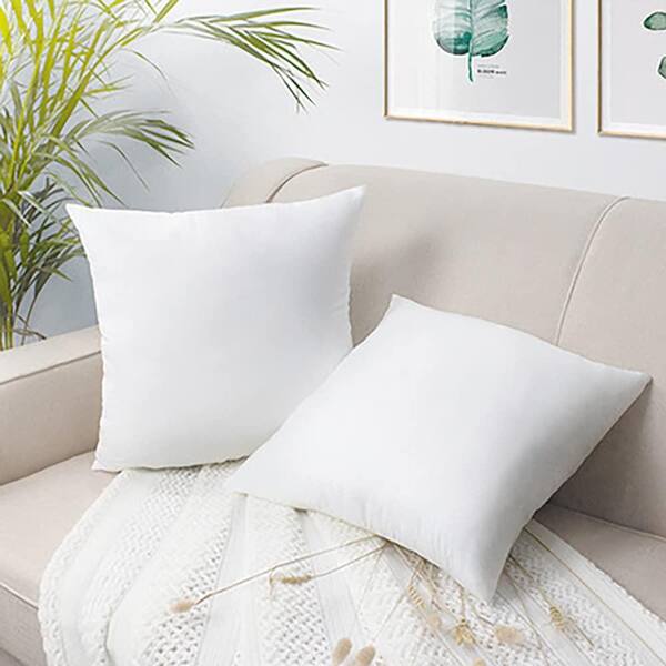 square pillows on bed