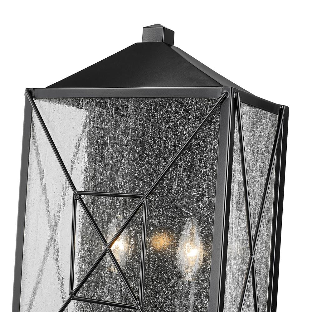 Caswell Black Metal Outdoor Wall Sconce with Clear Glass