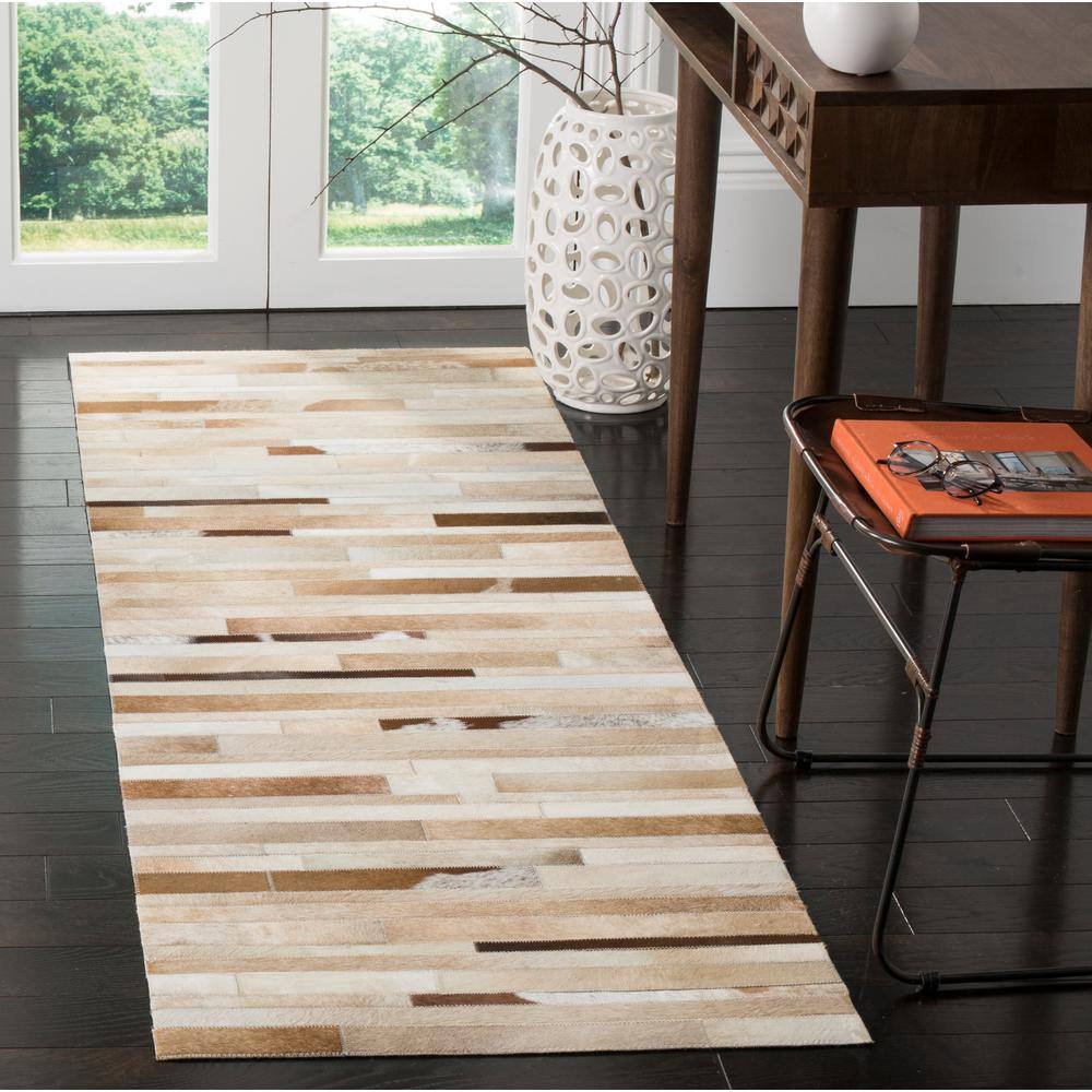Handmade Ivory Geometric Cowhide Area Rug 27" x 9"