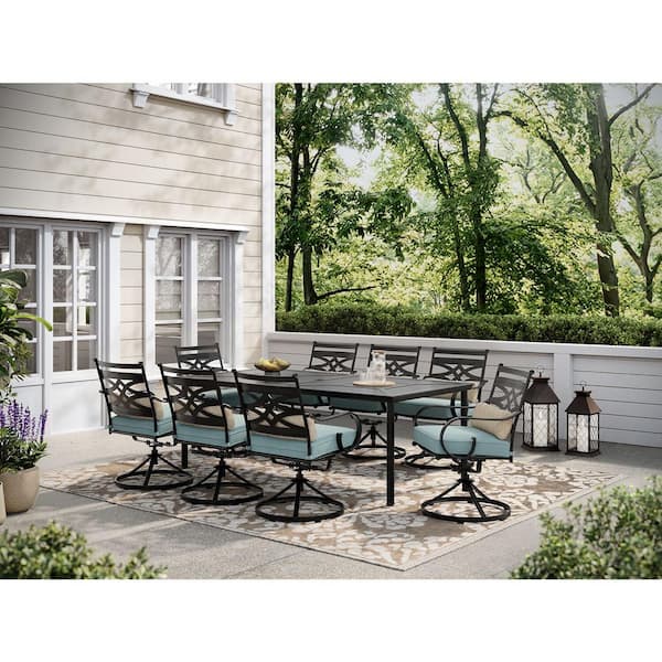 Hanover Montclair 9-Piece Steel Outdoor Dining Set with Ocean Blue Cushions, 8 Swivel Rockers and 42 in. x 84 in. Table
