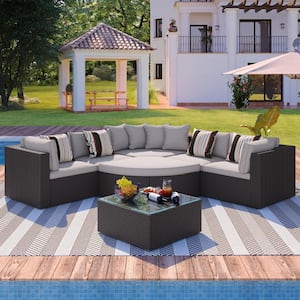 7-Piece Outdoor Brown Wicker Patio Conversation Set with Gray Cushions and Colorful Pillows