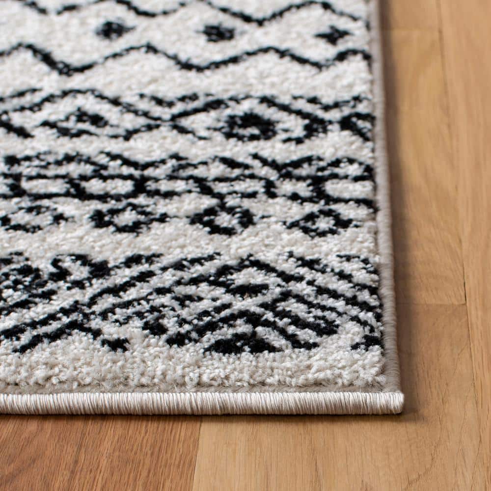 8' x 10' Black and Ivory Geometric Synthetic Area Rug