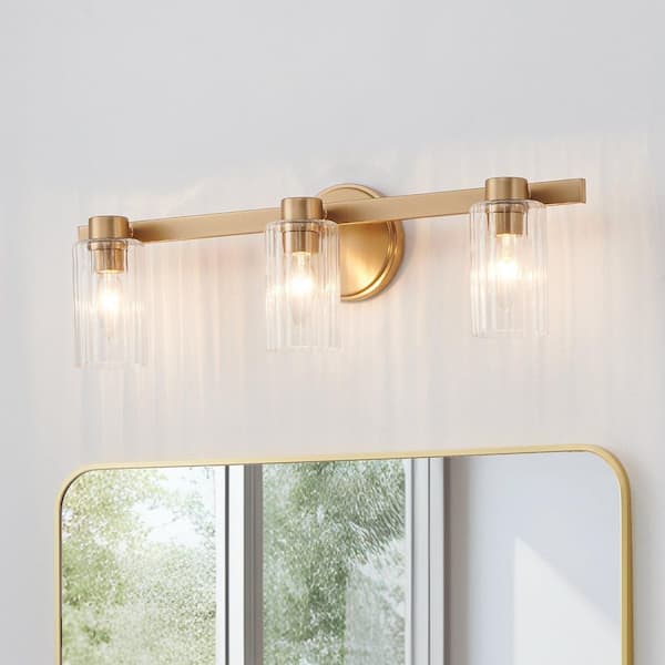 Bedminster 24-in. 3-light Champagne Gold Vanity Light with Clear Ribbed Glass Shades