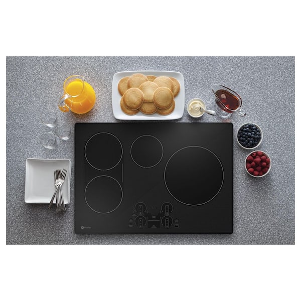 GE Profile 30-in 4 Burners Black Smart Induction Cooktop in the