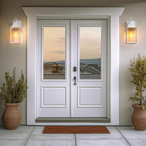 Decorators 14 in. E26 White Farmhouse Cylinder Dusk to Dawn Outdoor Hardwired Cylinder Glass Sconce