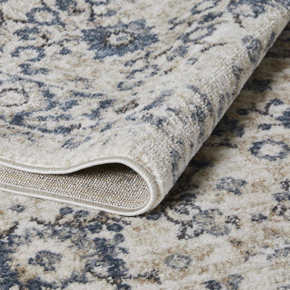 Cream and Blue Floral Border 6' x 9' Synthetic Area Rug