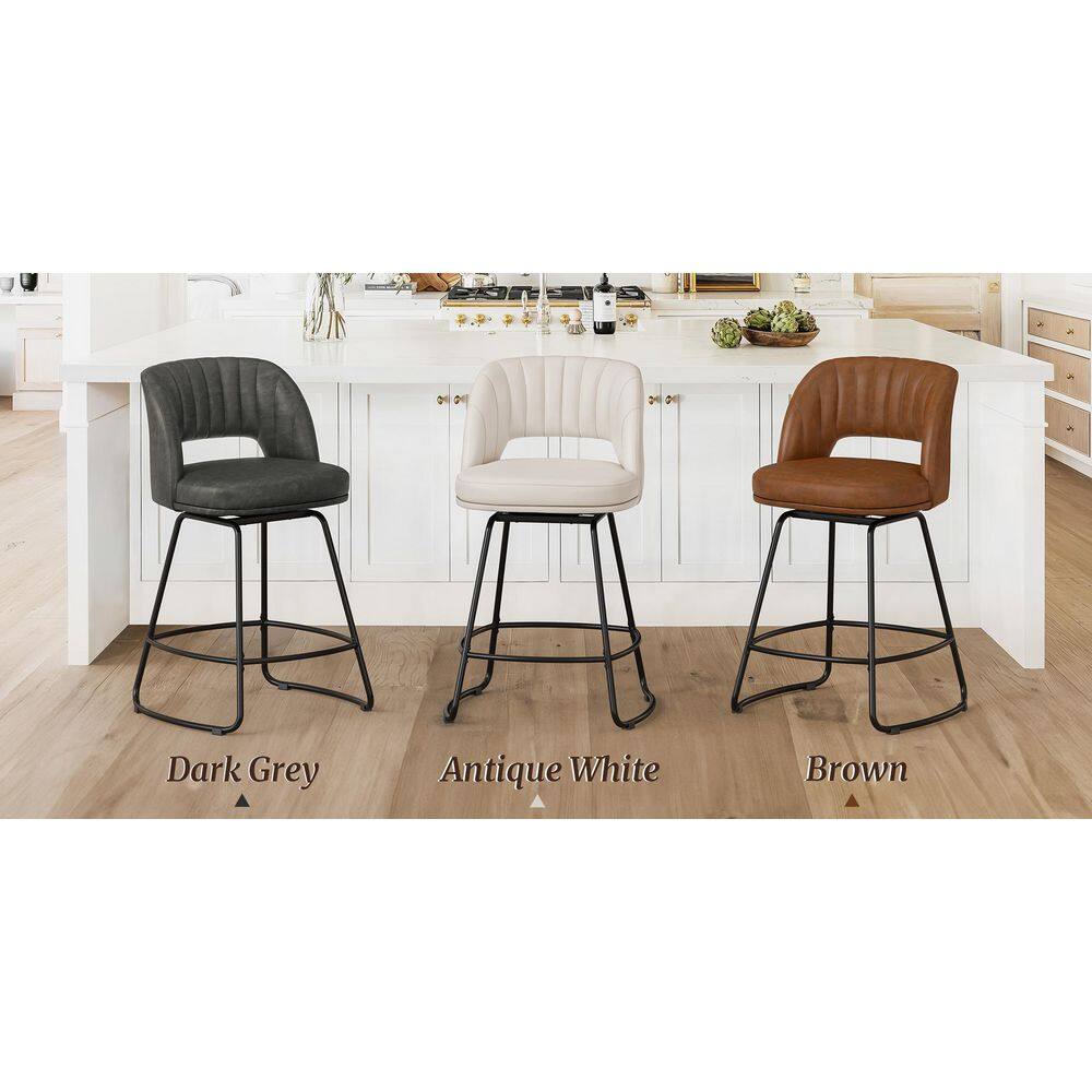 Three counter stools in dark grey, antique white, and brown faux leather.