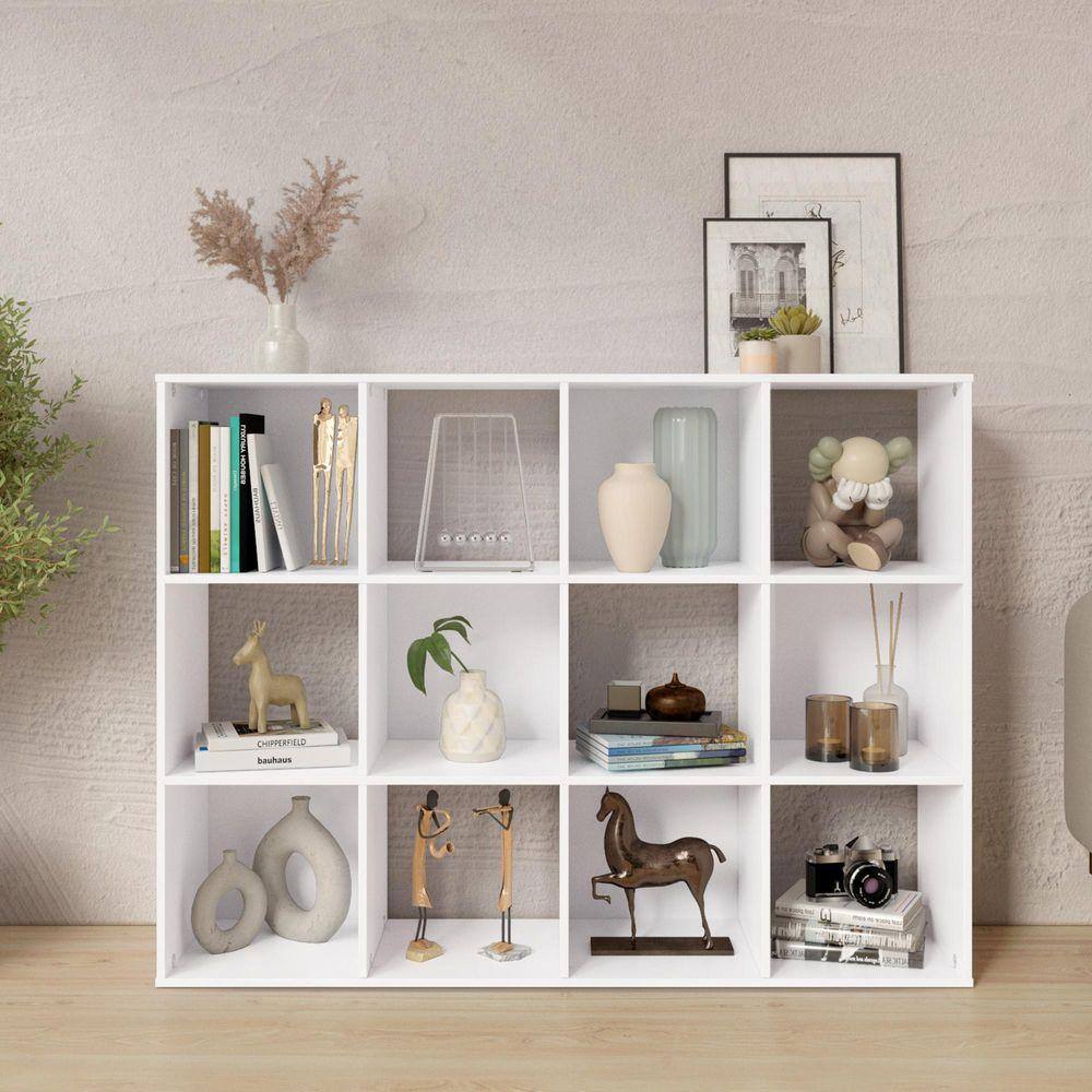White wood 3-shelf etagere bookcase styled with home accessories.