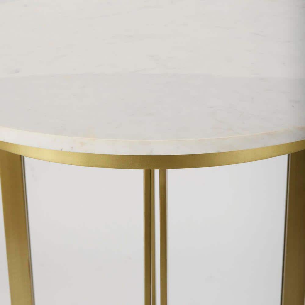 Close-up of the white marble tabletop and gold metal rim.