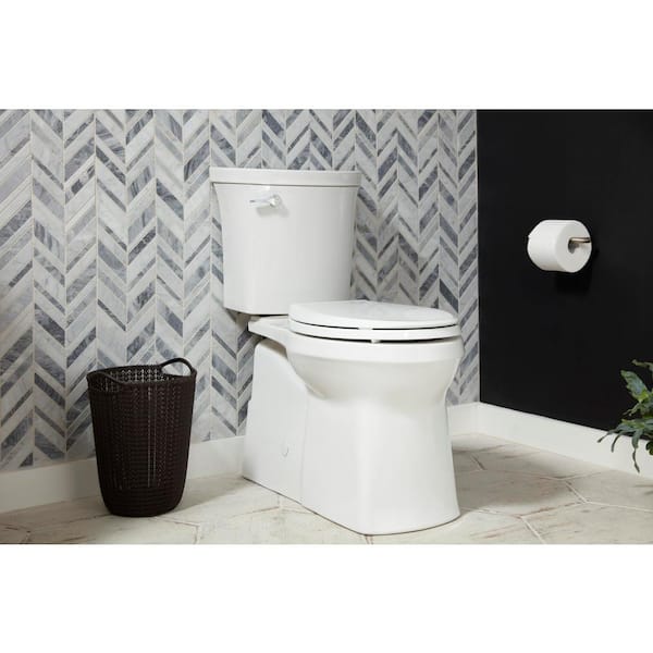 Valiant 10 in. Rough In 2-Piece 1.28 GPF Single Flush Elongated Toilet in White Seat and Rough-In Adapter Included