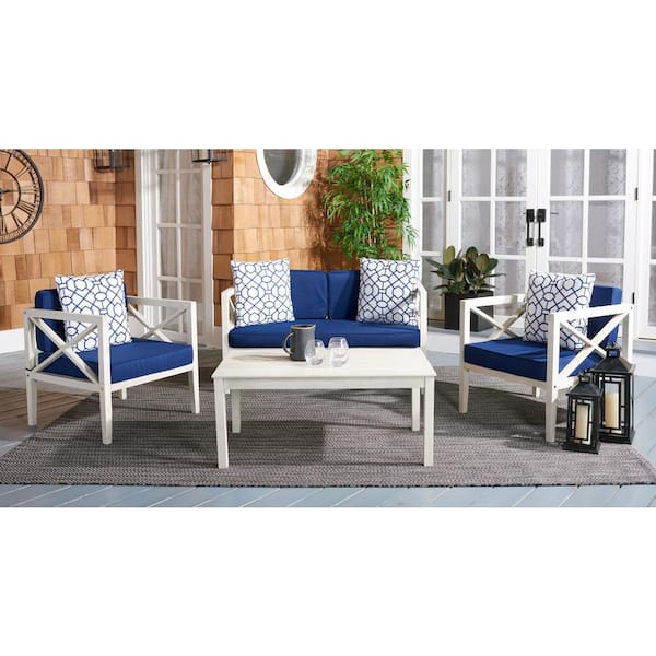 Nunzio White 4-Piece Wood Patio Conversation Set with Navy Cushions and White Geometric Pillow