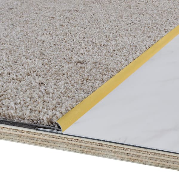 https://images.thdstatic.com/productImages/cf2aa2f6-457a-4f3c-bd4e-462a75be01bd/svn/satin-brass-carpet-transition-strips-06932-a0_600.jpg