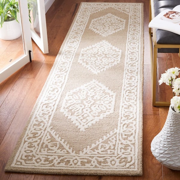 https://images.thdstatic.com/productImages/cf3dad13-161c-4711-9f6c-d2581a4c1e33/svn/ivory-brown-safavieh-area-rugs-met706t-29-e1_600.jpg