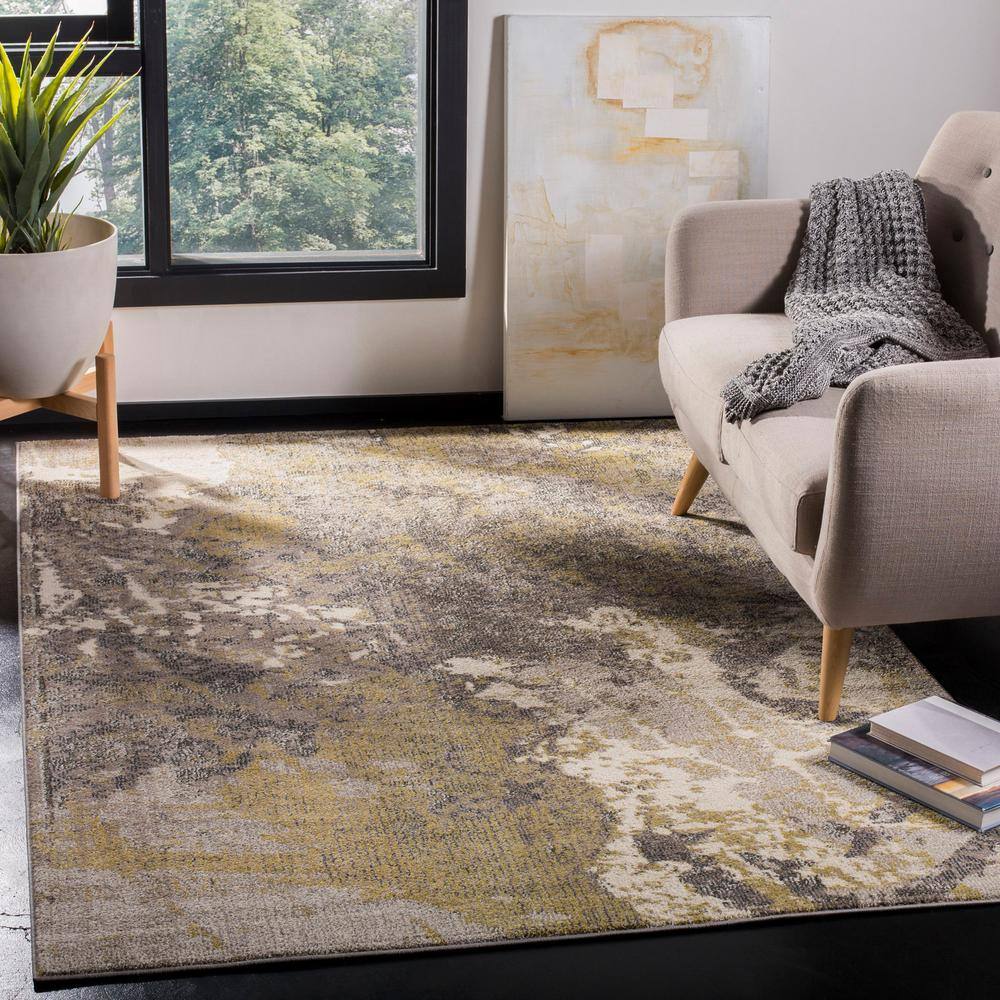 Ivory and Gray Abstract 9' x 12' Synthetic Area Rug
