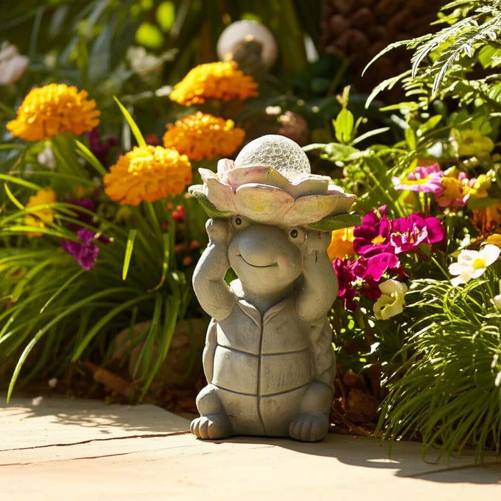 Liv & Skye Gray 15 in. Ceramic Turtle Holding Large Solar Flower