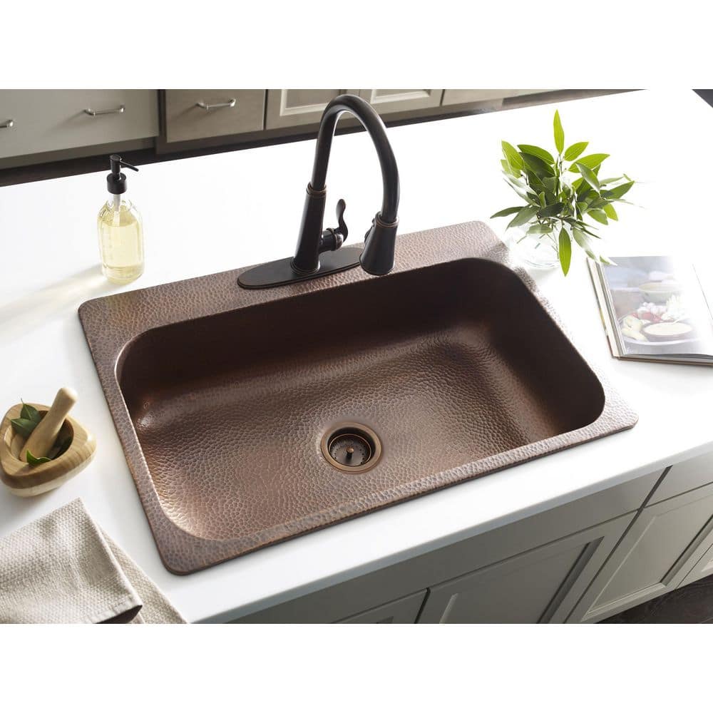 https://images.thdstatic.com/productImages/cfaa4c00-dcc3-4a37-9480-0769967a7a0e/svn/antique-copper-sinkology-drop-in-kitchen-sinks-sk101-33ac-64_1000.jpg