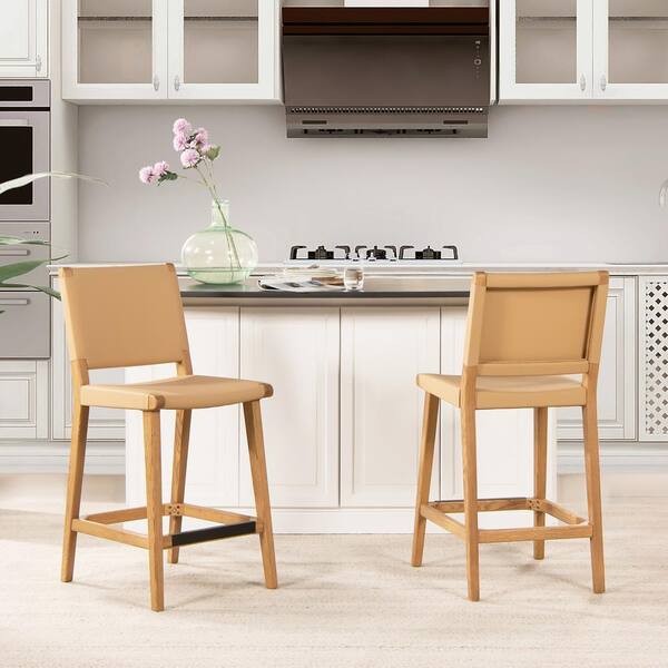 https://images.thdstatic.com/productImages/cfab04e1-b8b8-48d6-88fb-00939b614892/svn/sunkissed-beige-leather-jennifer-taylor-bar-stools-81311-mrl-my-64_600.jpg