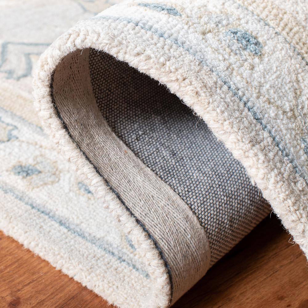Handmade Beige and Ivory Wool Tufted Area Rug