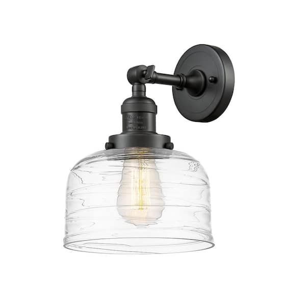 Bell 1-Light Oil Rubbed Bronze, Clear Deco Swirl Wall Sconce with Clear Glass Shade