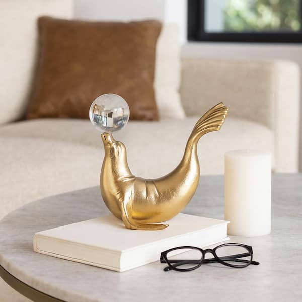 Liv & Skye Gold 7 in. x 7 in. Metal Novelty Sea Lion Figurine with Acrylic Ball