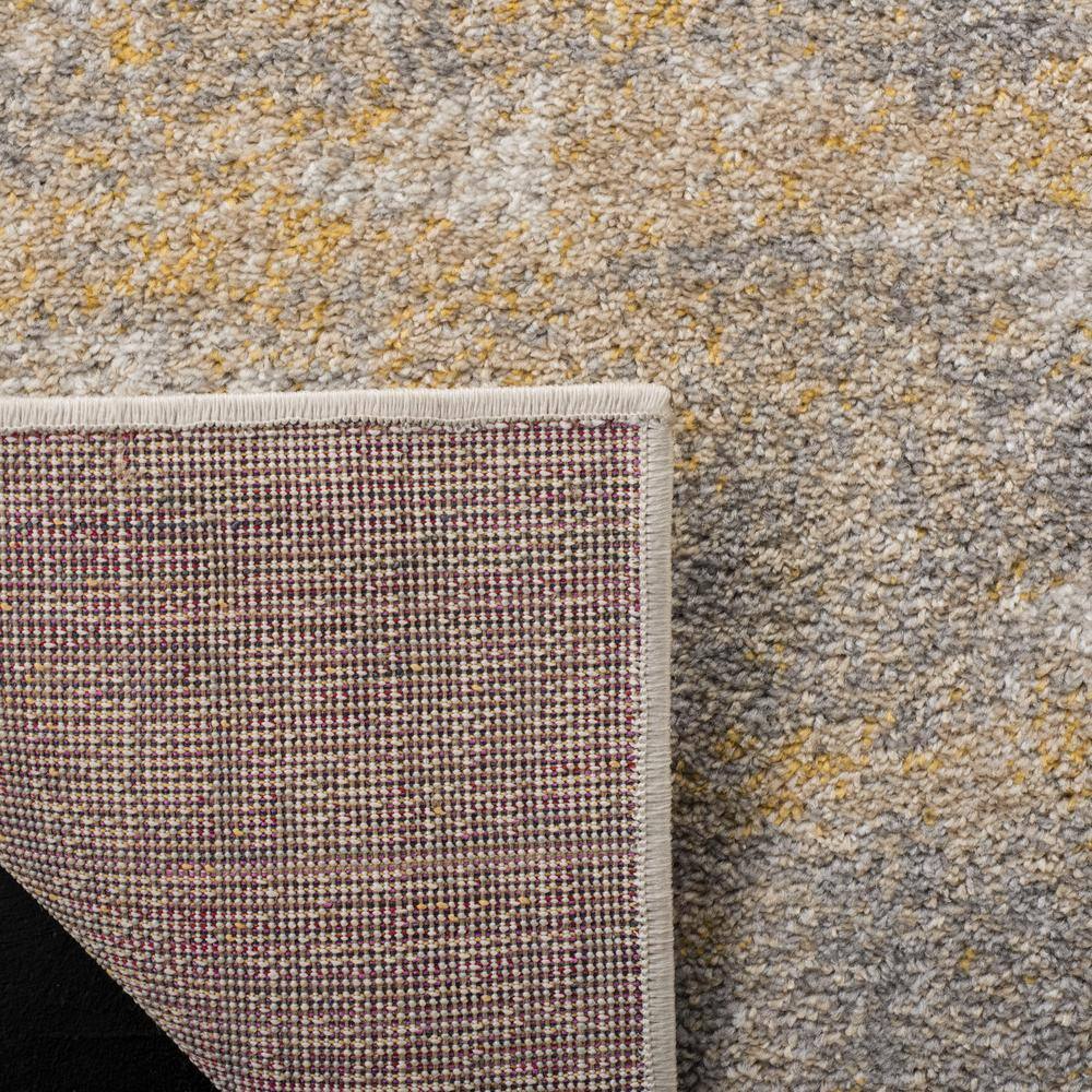 Creme and Gold Abstract Synthetic Area Rug 4' x 6'