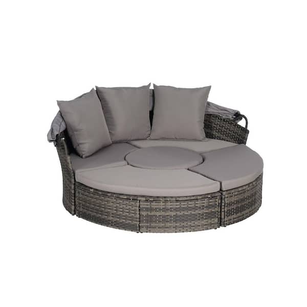 Gray Wicker Outdoor Day Bed with Dark Gray Cushions and Retractable Canopy