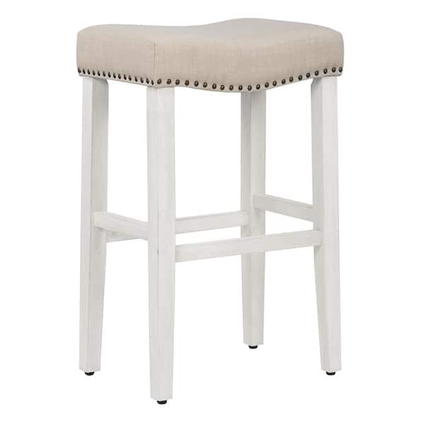 WESTINFURNITURE Jameson 29 in. Bar Height Antique White Wood Backless Nailhead Trim Barstool with Upholstered Beige Linen Saddle Seat