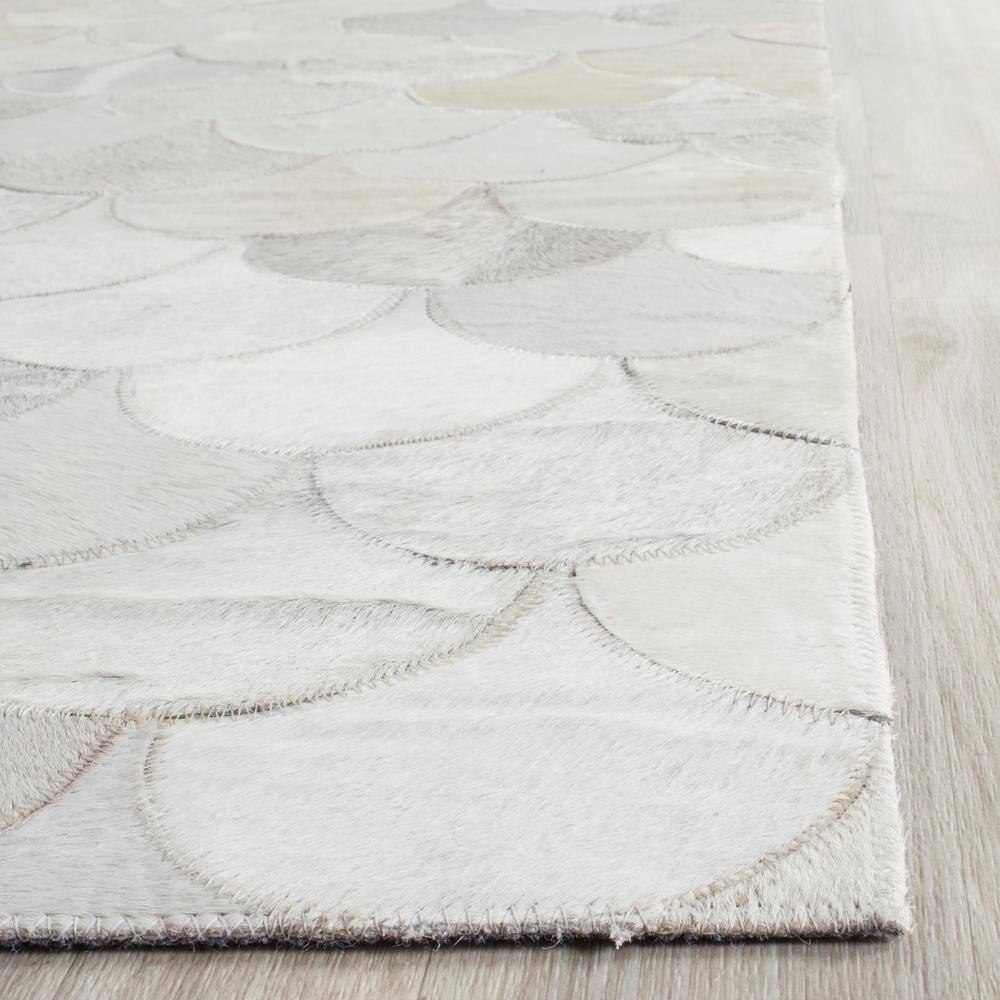 Ivory Geometric Handmade Cowhide Area Rug